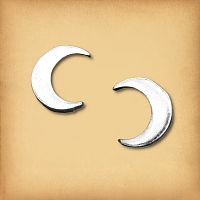 A pair of sterling silver new moon earrings, showing their graceful, uncomplicated crescent design.