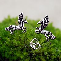 Closeup of Silver Pegasus Post Earrings, paired with a standard friction back, highlighting the simple and effective design.