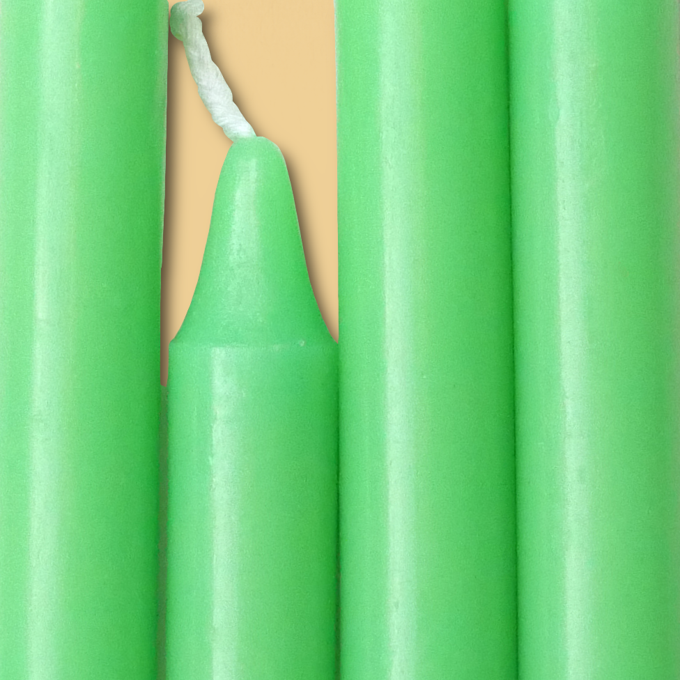 Closeup of a quartet of Apple Green Chime Candles arranged side-by-side so they form an almost solid block of color.