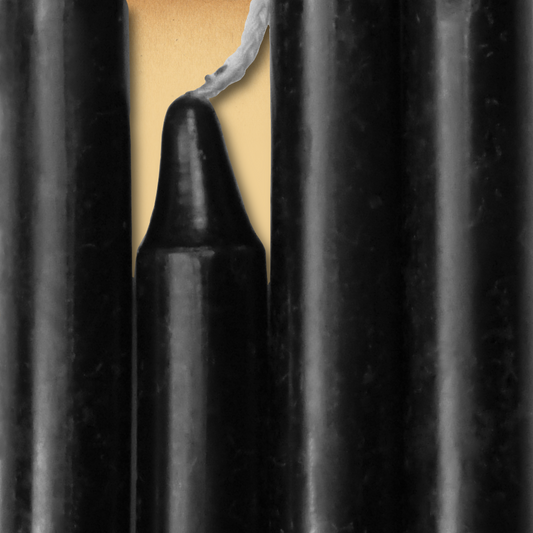 Closeup of a quartet of Black Chime Candles arranged side-by-side so they form an almost solid block of color.