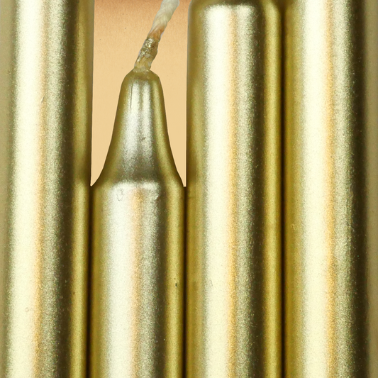 Closeup of a quartet of Metallic Gold Chime Candles arranged side-by-side so they form an almost solid block of color.