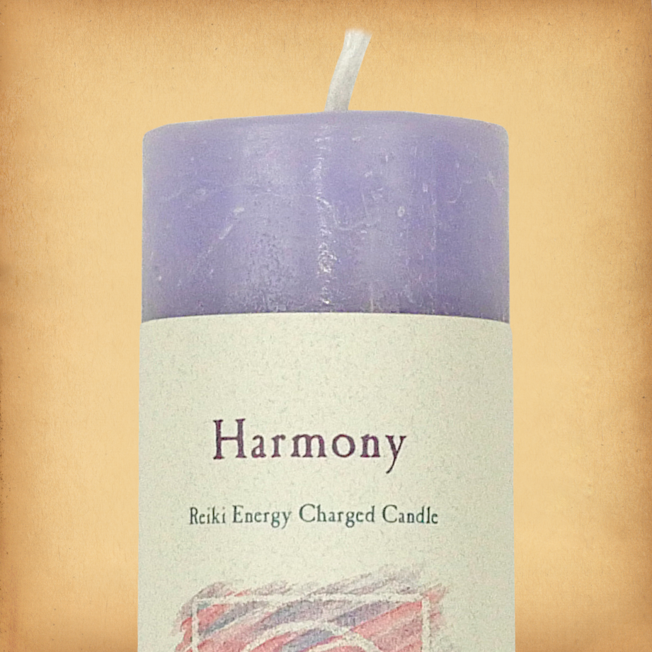 Purple pillar candle labeled “Harmony” with “Reiki Energy Charged Candle” beneath. Slim pillar candle with a single wick.