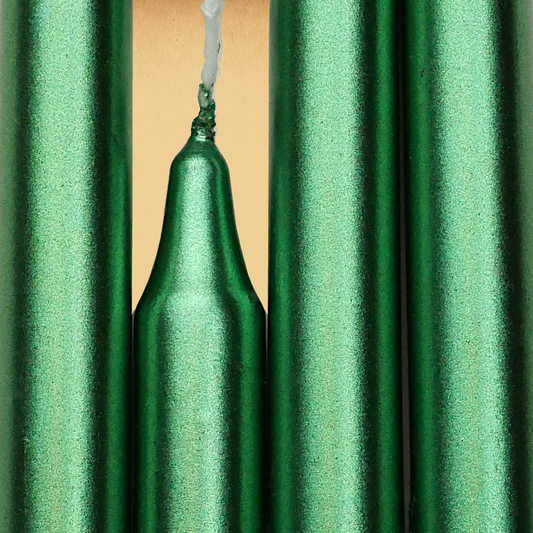 Closeup of a quartet of Metallic Green Chime Candles arranged side-by-side so they form an almost solid block of color.