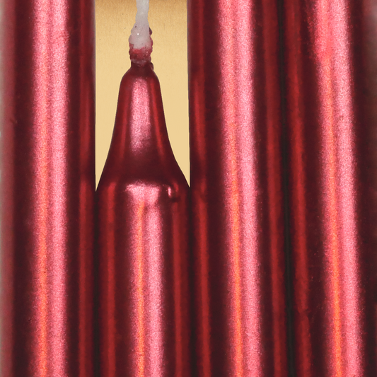 Closeup of a quartet of Metallic Red Chime Candles arranged side-by-side so they form an almost solid block of color.