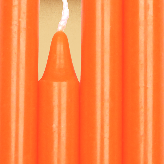 Closeup of a quartet of Orange Chime Candles arranged side-by-side so they form an almost solid block of color.