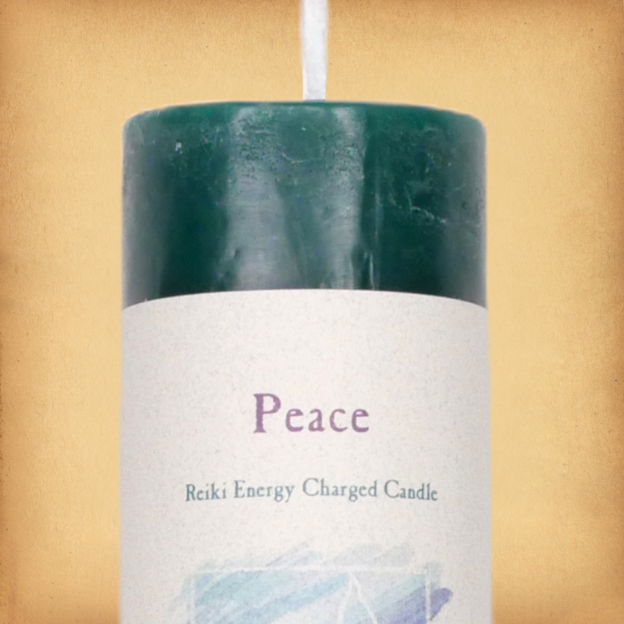 Green pillar candle labeled “Peace” with “Reiki Energy Charged Candle” beneath. Slim pillar candle with a single wick.