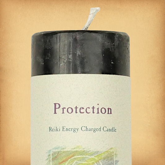 Black pillar candle labeled “Protection” with “Reiki Energy Charged Candle” beneath. Slim pillar candle with a single wick.