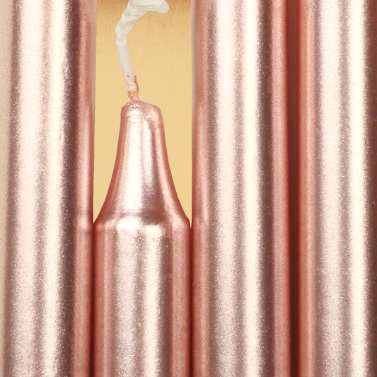Closeup of a quartet of Rose Gold Chime Candles arranged side-by-side so they form an almost solid block of color.