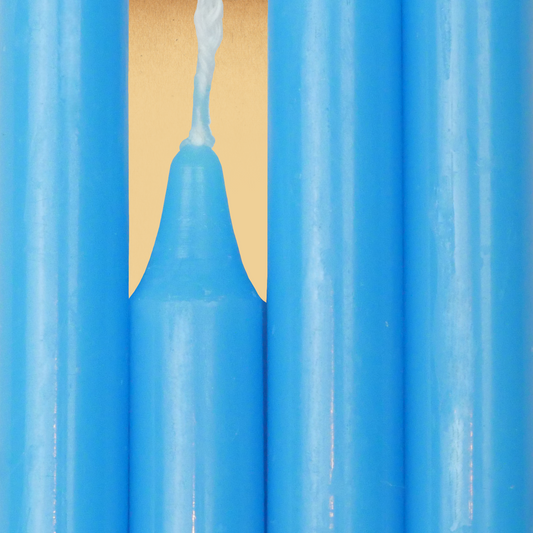 Closeup of a quartet of Sky Blue Chime Candles arranged side-by-side so they form an almost solid block of color.