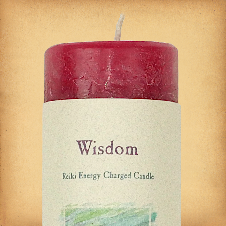 Red pillar candle labeled “Wisdom” with “Reiki Energy Charged Candle” beneath. Slim pillar candle with a single wick.