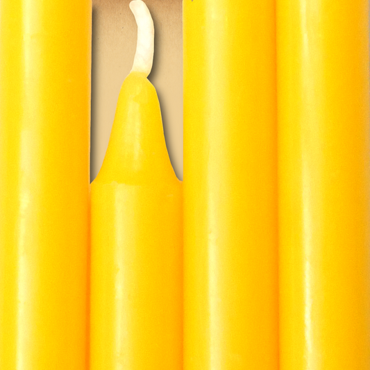 Closeup of a quartet of Yellow Chime Candles arranged side-by-side so they form an almost solid block of color.