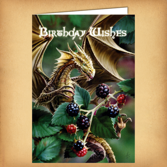 A fantasy birthday card featuring a tiny golden dragon perched among blackberry vines, with the words “Birthday Wishes”.