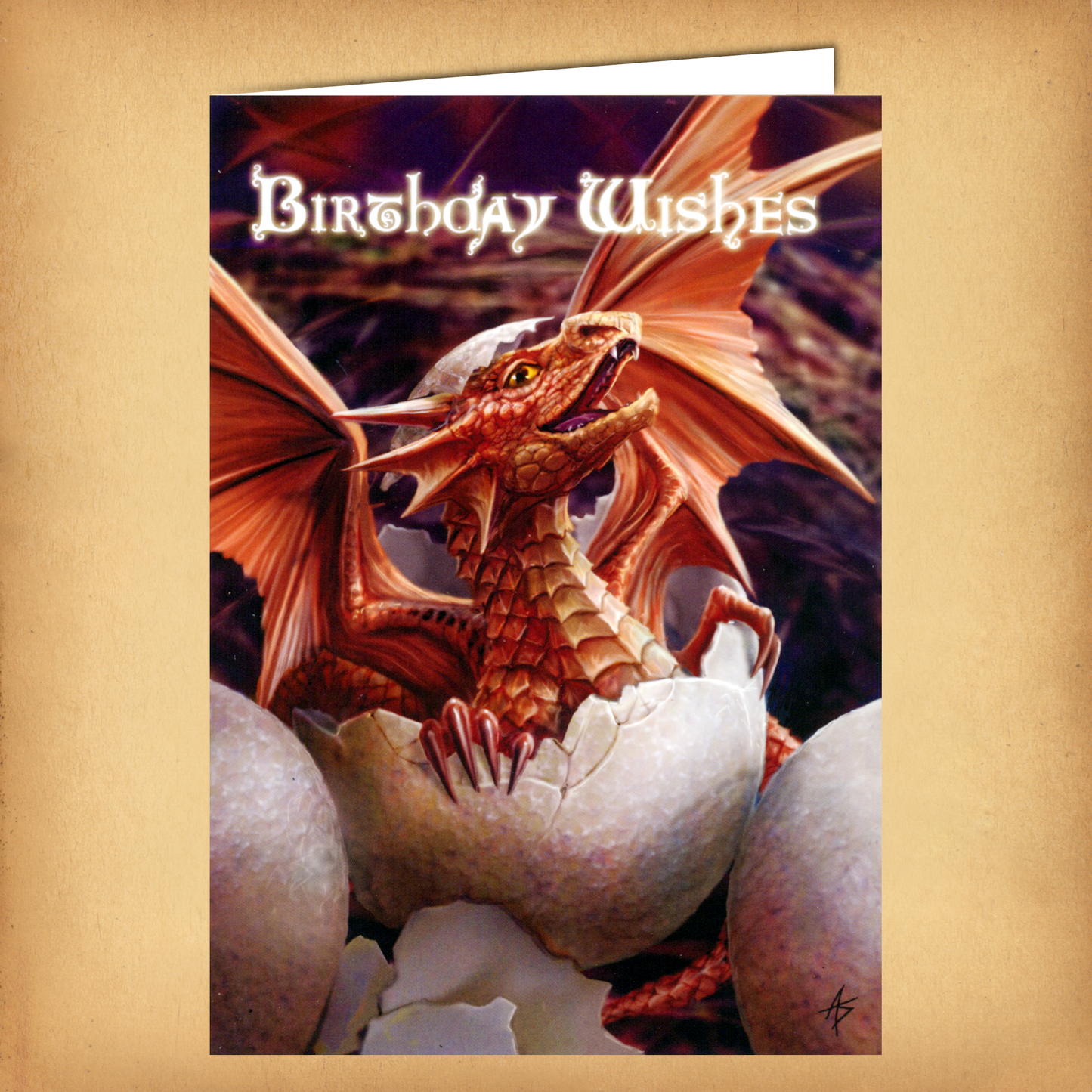 Fantasy birthday card featuring a newly hatched red dragon emerging from its egg, wings spread wide beneath “Birthday Wishes”