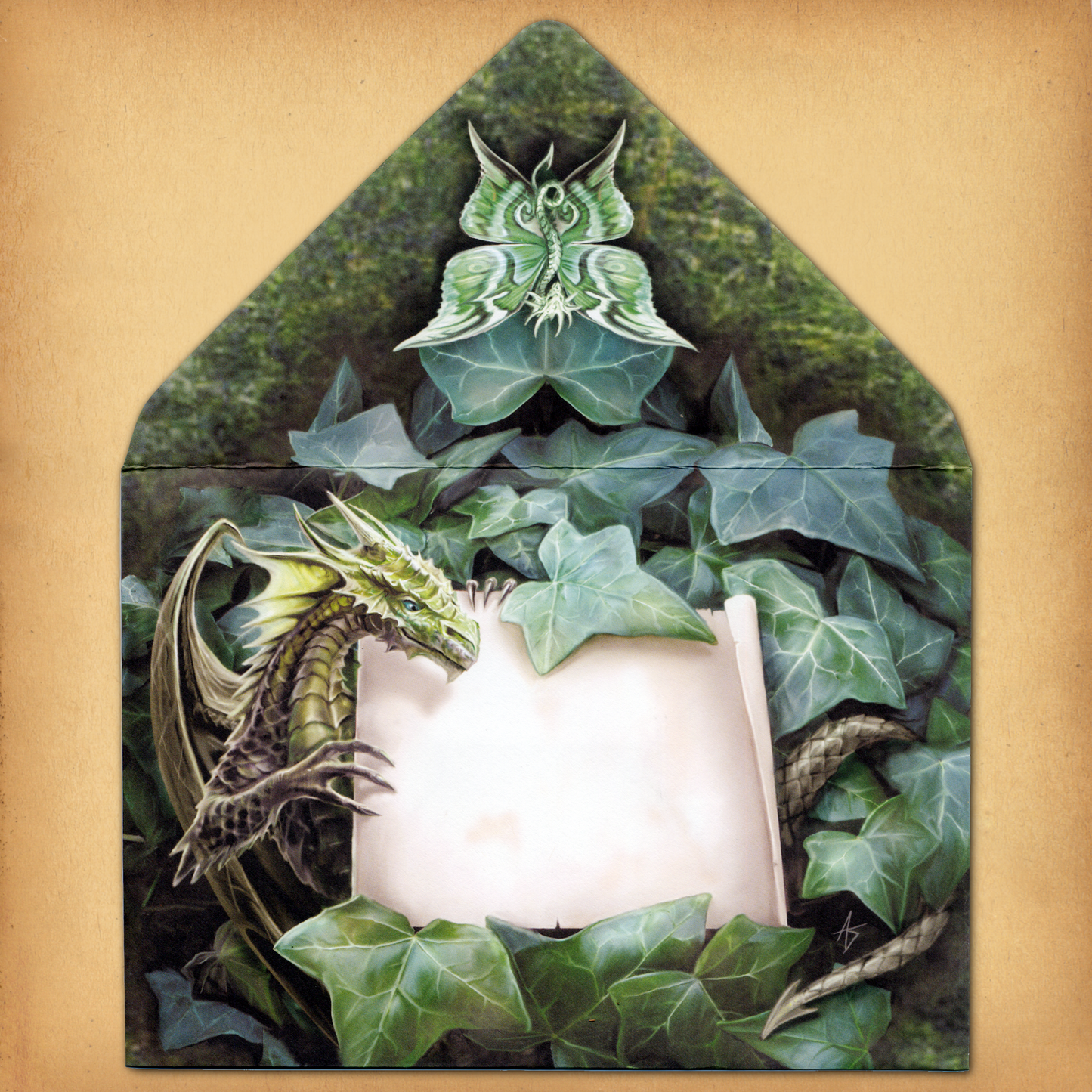 A decorative envelope featuring a dragon emerging from ivy, grasping a blank scroll, and on the flap, a moth-winged dragon.
