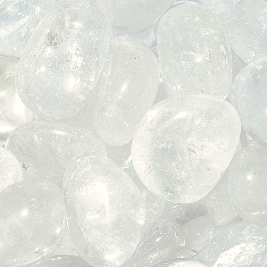 Tumbled Clear Quartz gemstones, crystal-clear, with occasional wisps of translucent white, and a smooth polished finish.