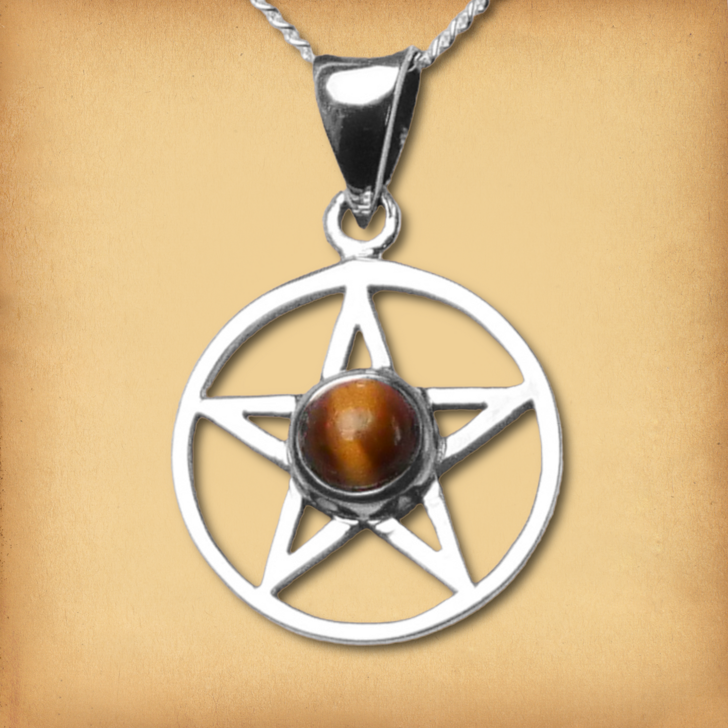Silver Pentacle Pendant w/ Tiger Eye, showcasing a striking golden-brown gemstone within the classic five-pointed star design