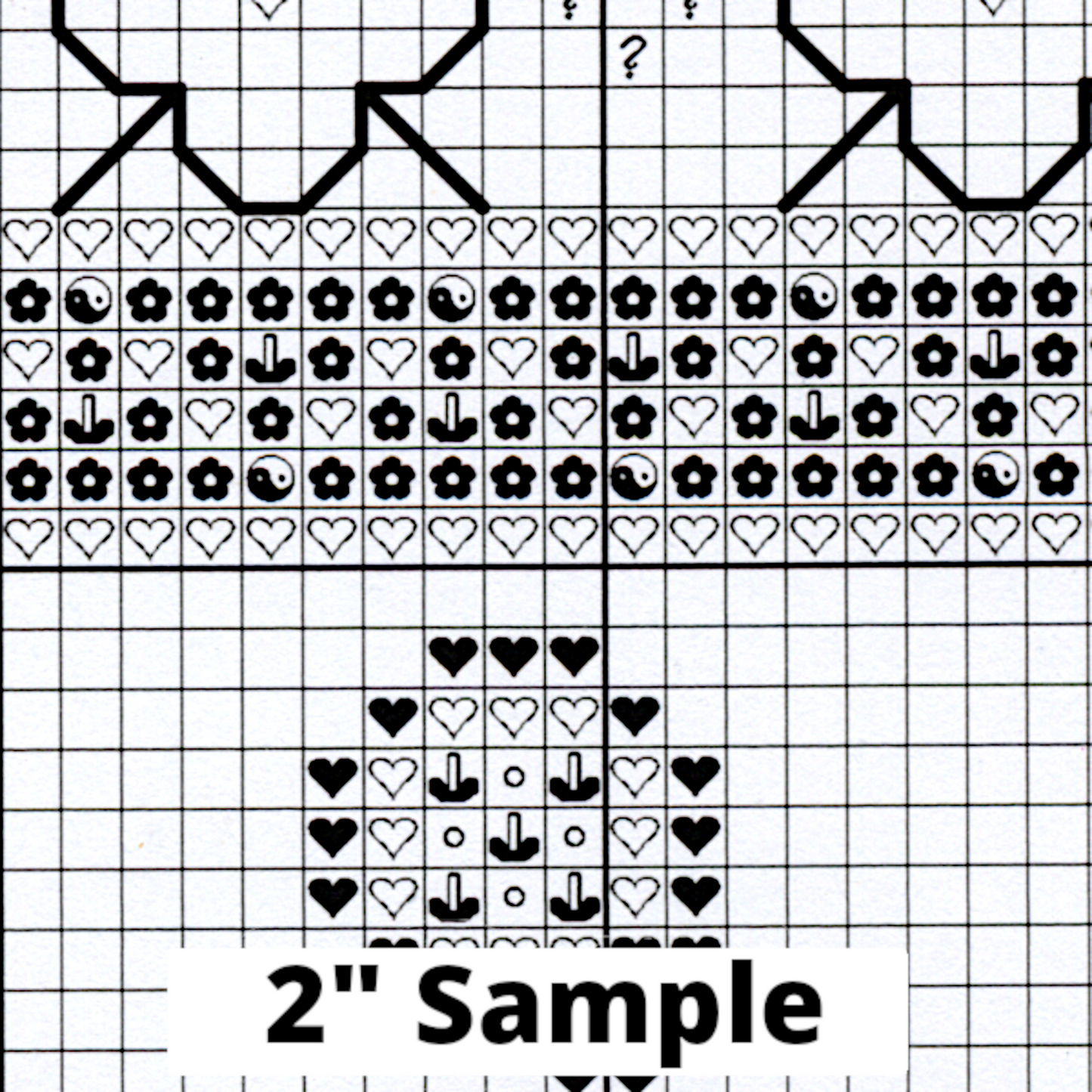Part of the printed cross stitch chart, showing 2” section of the gridded pattern, with black/white symbols for each stitch.