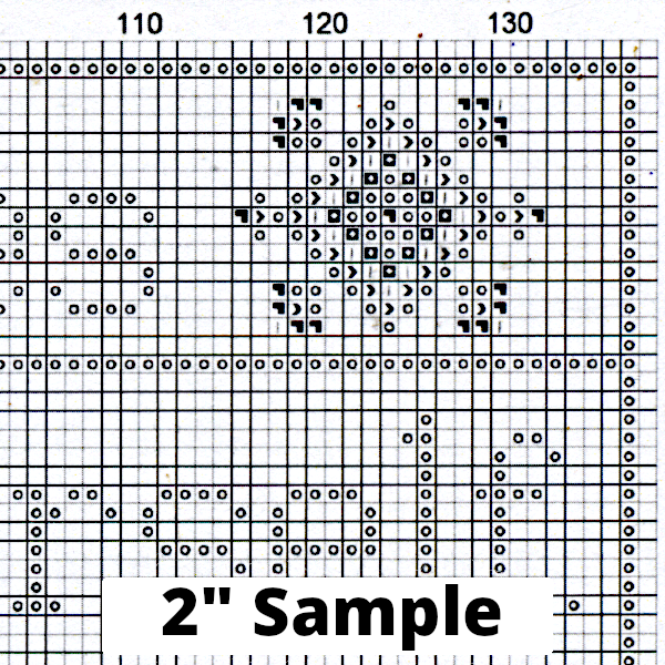 Part of the printed cross stitch chart, showing 2” section of the gridded pattern, with black/white symbols for each stitch.