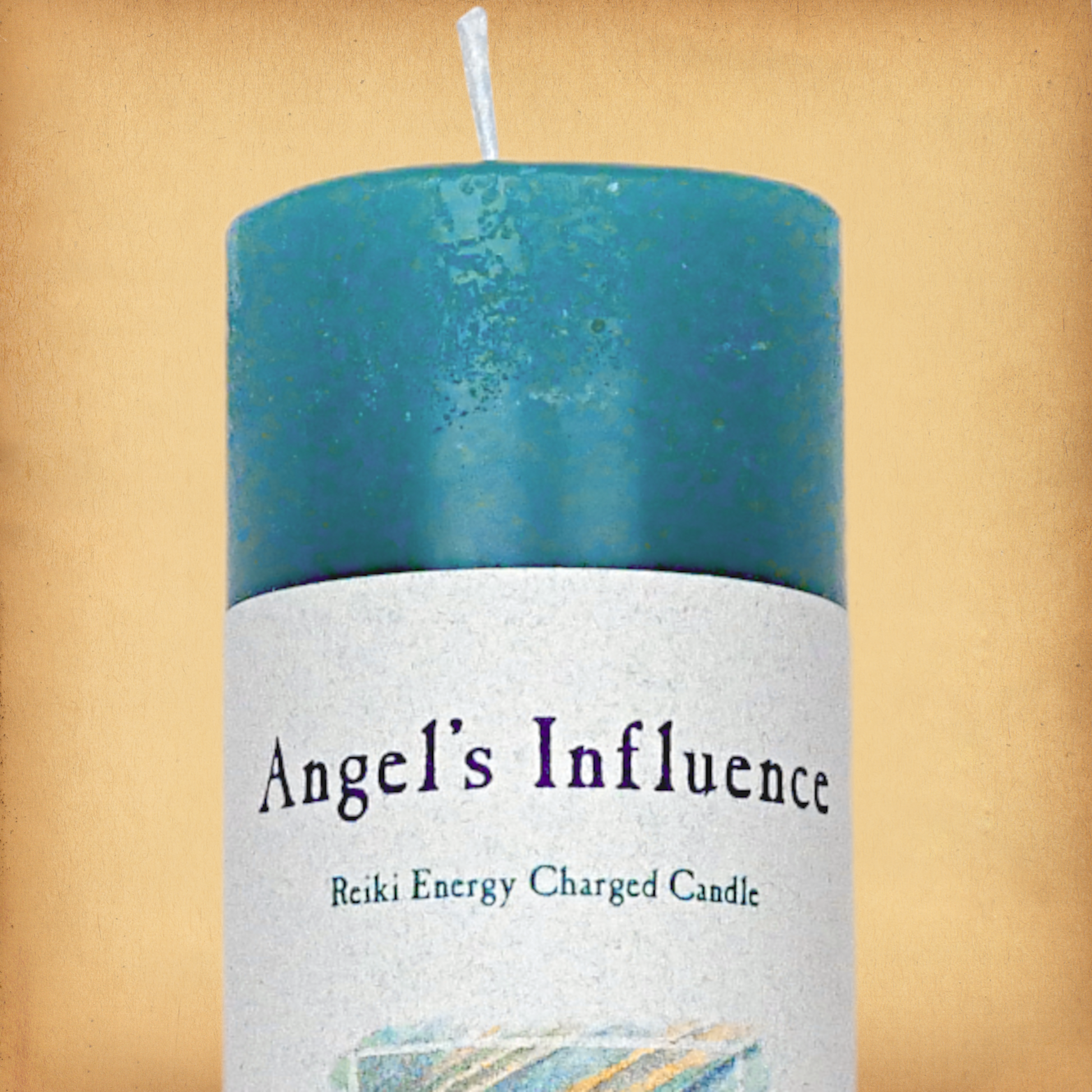 Turquoise pillar candle labeled “Angel’s Influence” and “Reiki Energy Charged Candle”. Slim pillar candle with a single wick.