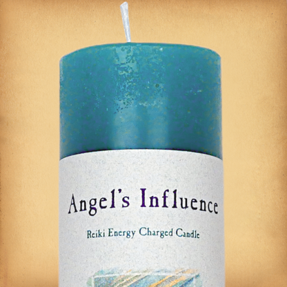 Turquoise pillar candle labeled “Angel’s Influence” and “Reiki Energy Charged Candle”. Slim pillar candle with a single wick.