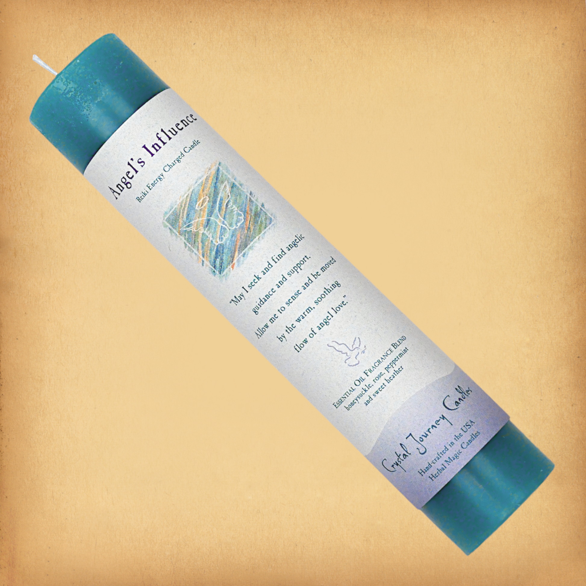 Turquoise Reiki-charged Angel’s Influence Pillar Candle, laid diagonally to show label with affirmation, essential oil blend.