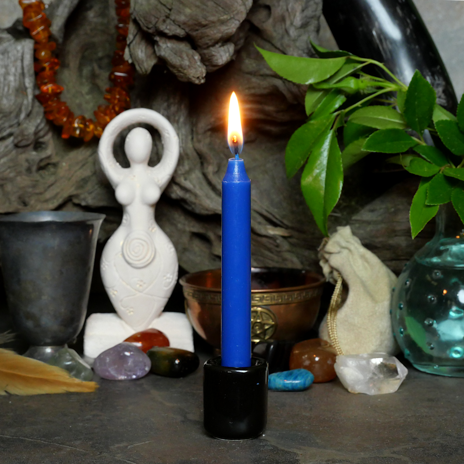 A lit royal Blue Chime Candle, in a personal altar display, showing how it might be used in a ritual or ceremonial setting.