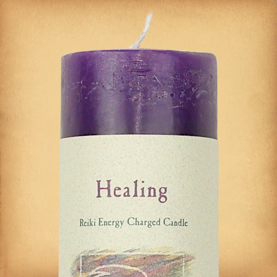 Purple pillar candle labeled “Healing” with “Reiki Energy Charged Candle” beneath. Slim pillar candle with a single wick.