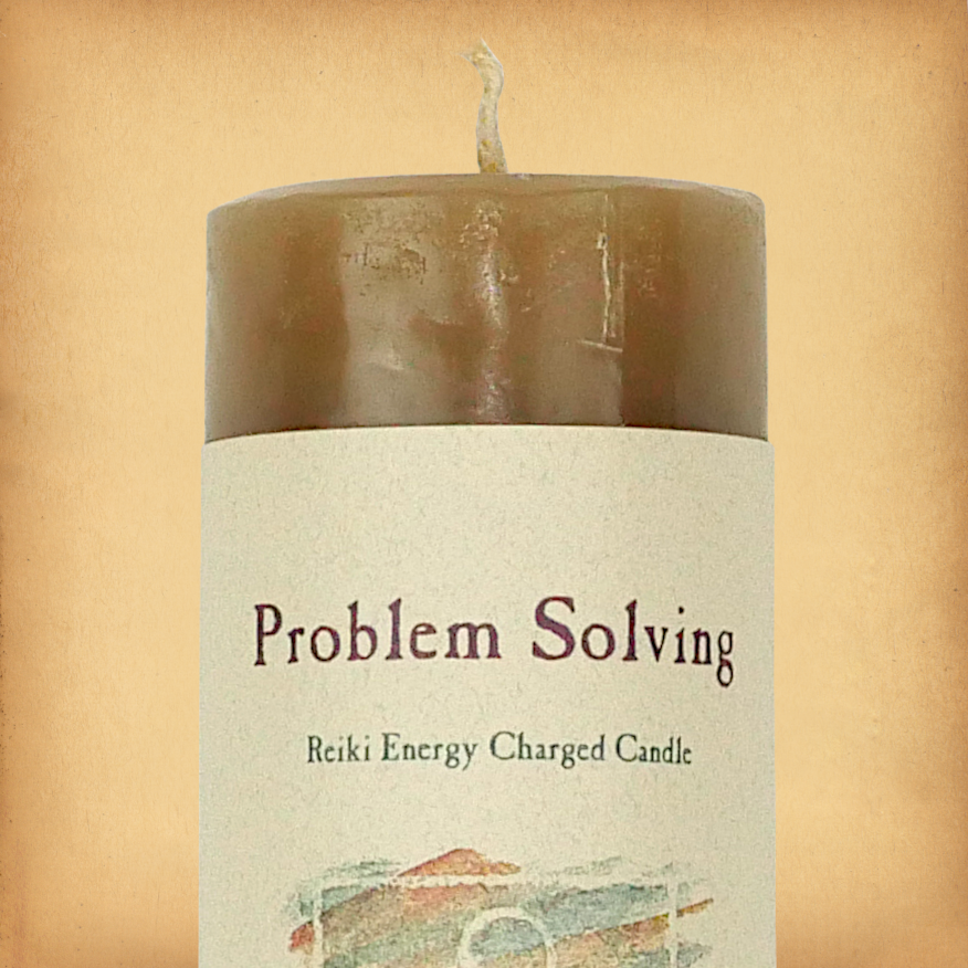 Brown pillar candle labeled “Problem Solving” with “Reiki Energy Charged Candle” beneath. Slim pillar candle with single wick