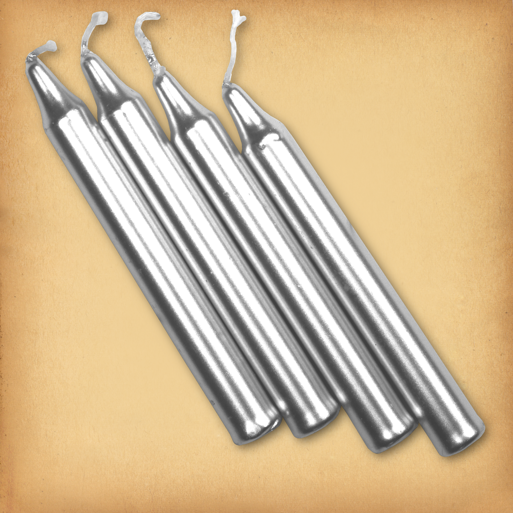 An overhead view of four Silver Chime Candles, diagonally placed on a plain surface, showing the candles' proportions.