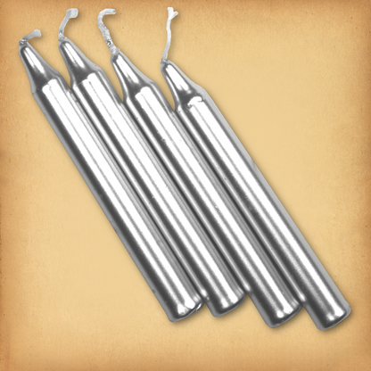 An overhead view of four Silver Chime Candles, diagonally placed on a plain surface, showing the candles' proportions.