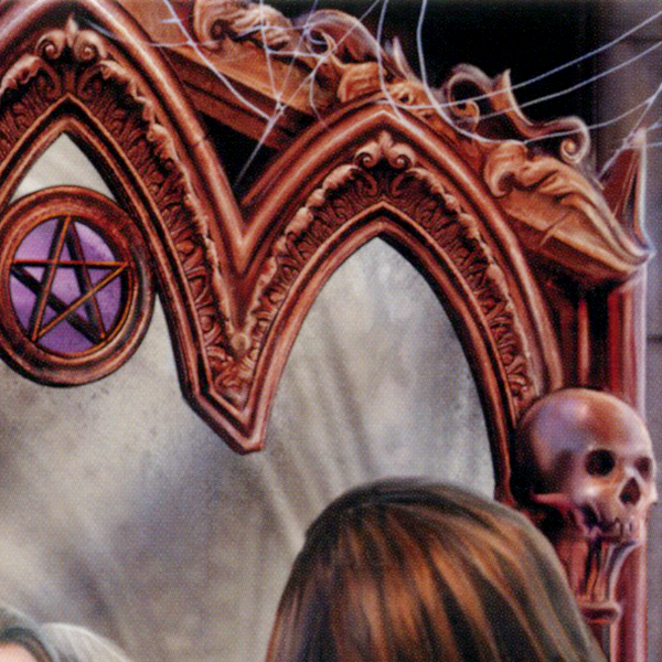 Close-up of the gothic mirror’s ornate frame, adorned with a pentacle, skulls, and spiderwebs, enhancing its eerie charm.