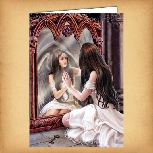 A fantasy greeting card featuring a woman in white kneeling before a gothic mirror, where her reflection appears as an angel.