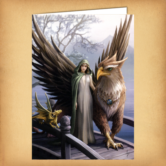 Fantasy greeting card featuring a cloaked woman standing beside a majestic griffin, with a tiny golden dragon watching nearby
