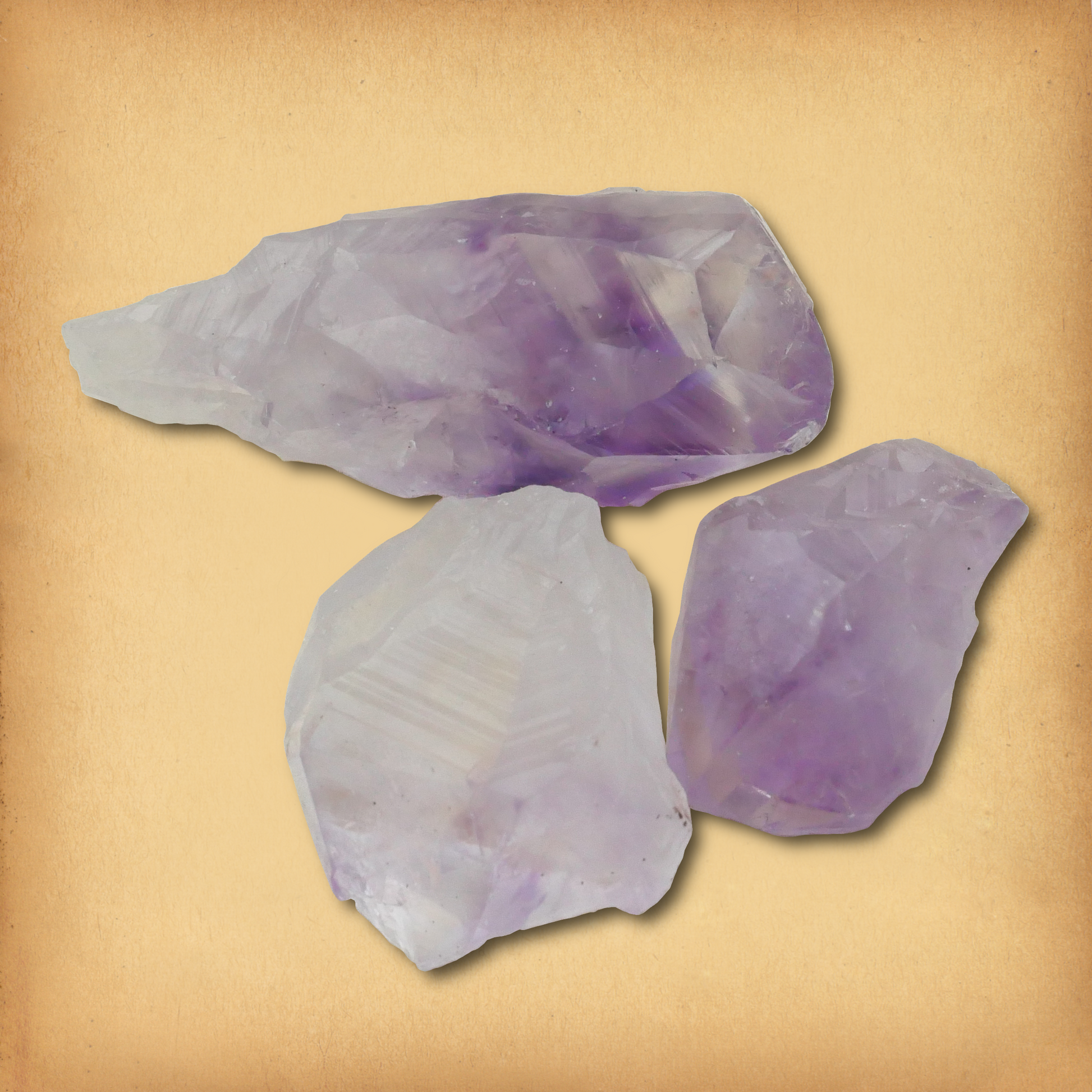 Three Natural Amethyst Gemstone Points in white, lavender, and purple hues, demonstrating the typical variety in a set.
