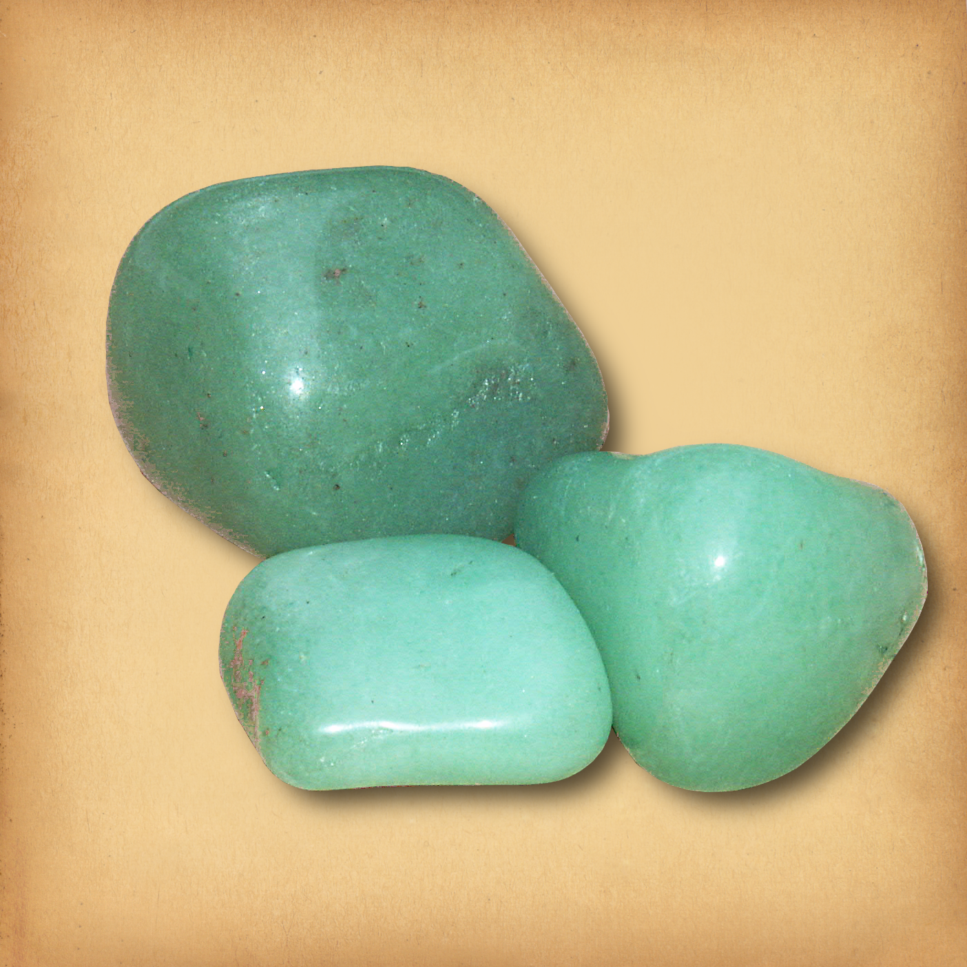 Three tumbled Green Aventurine gemstones in soft, milky green hues, showing the typical varietions of size and color in a set