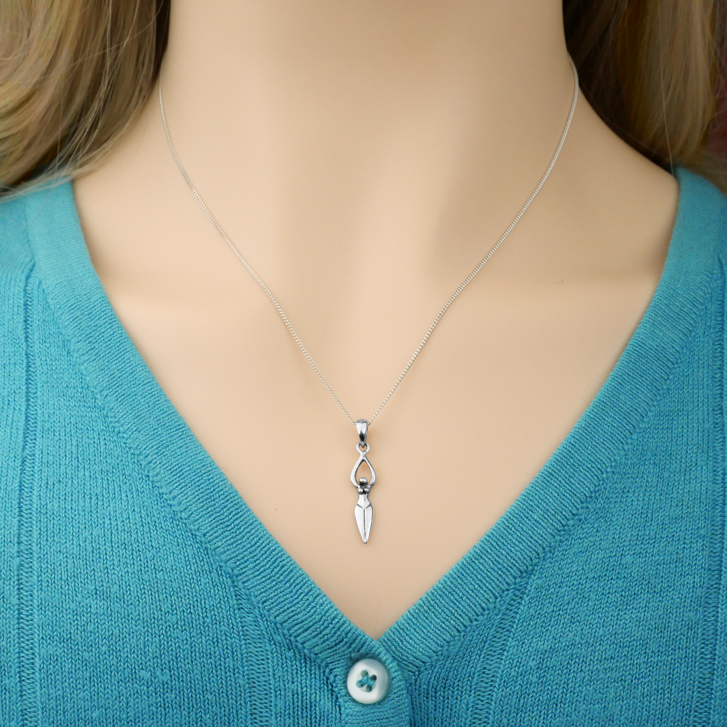 Graceful model wearing the sterling Silver Goddess Pendant. Perfect for pagan jewelry lovers and spiritually empowered women.