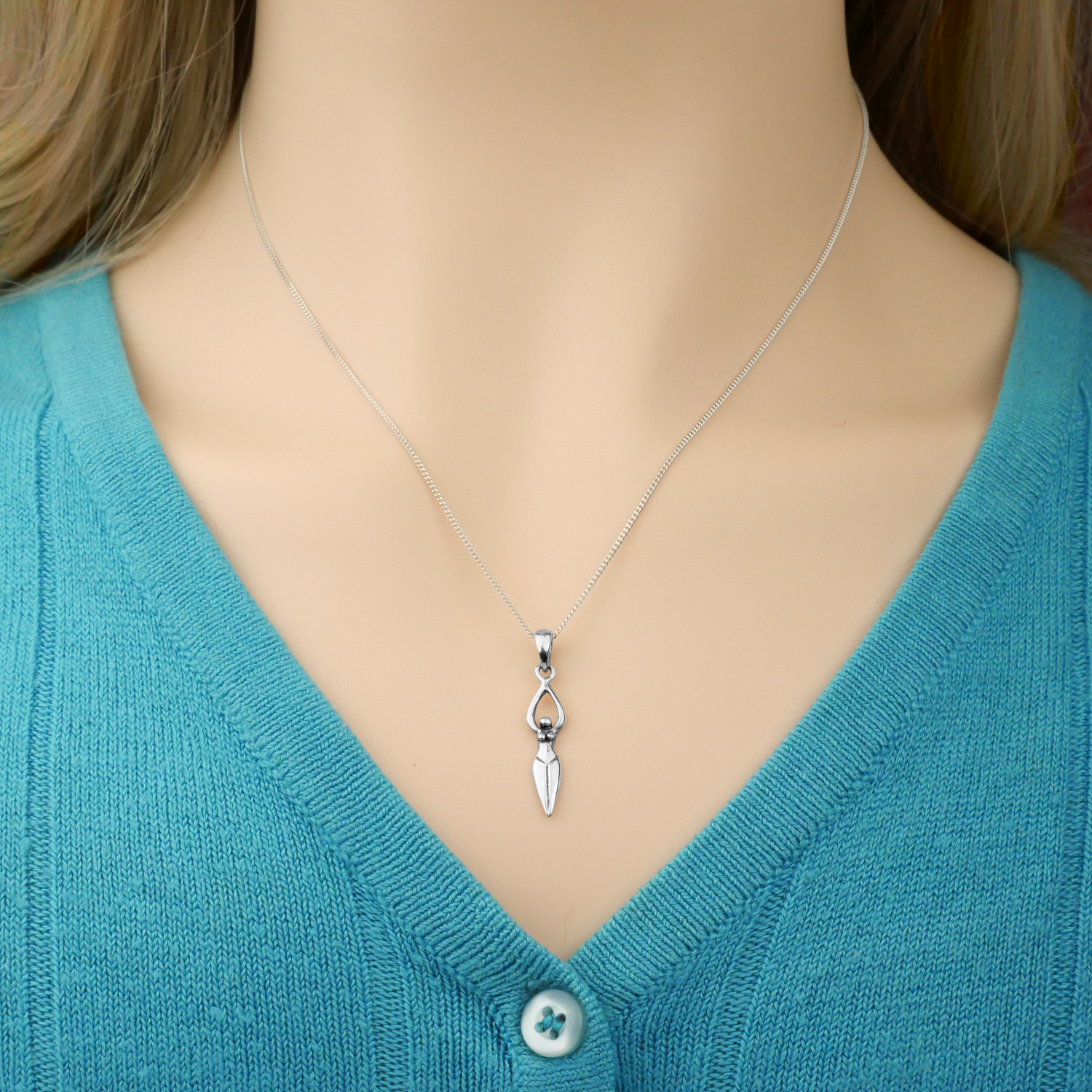 Graceful model wearing the sterling Silver Goddess Pendant. Perfect for pagan jewelry lovers and spiritually empowered women.