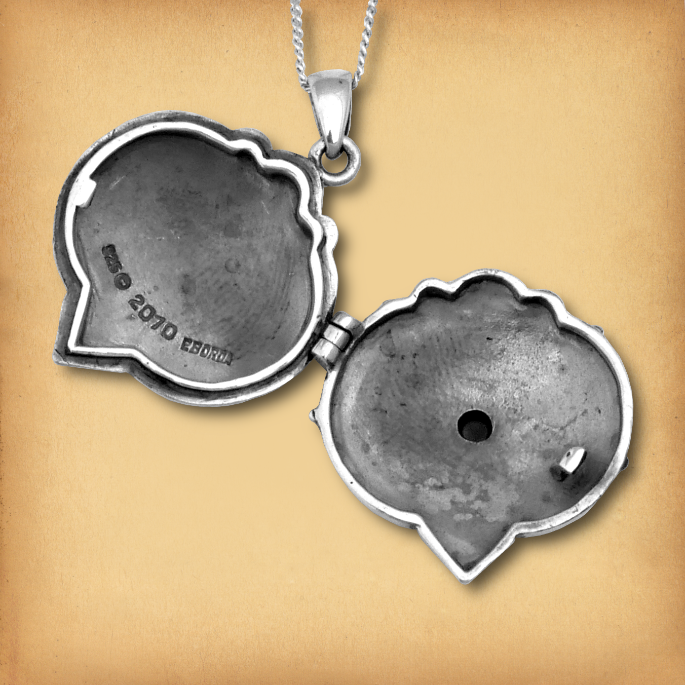 Interior view of the Silver Amethyst Heart Pentacle Locket, showcasing its sturdy design and functional compartment.