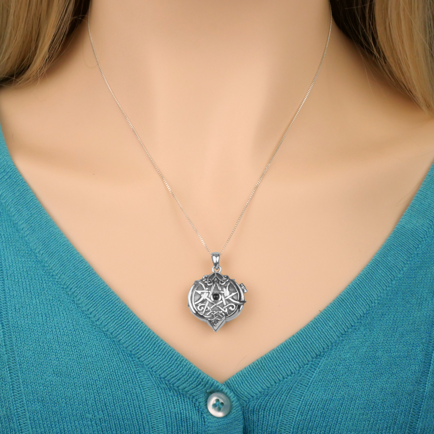 Silver Amethyst Heart Pentacle Locket, worn by a model, showcasing its Celtic pentacle and moons design and amethyst gemstone