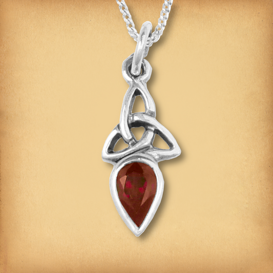 Silver Garnet Trinity Knot Pendant with a vibrant red garnet gemstone and a simple sterling silver Celtic knotwork setting.