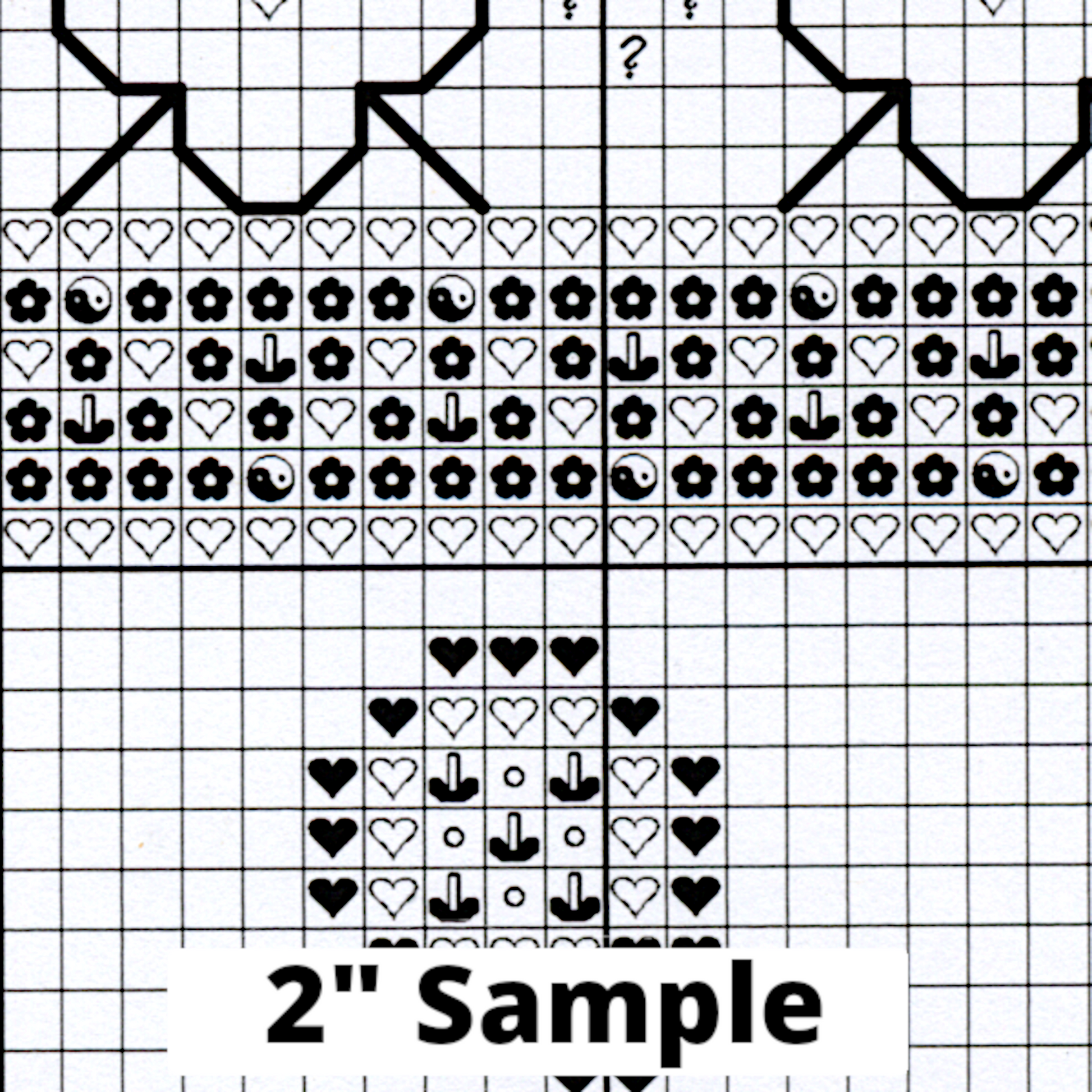 Part of the printed cross stitch chart, showing 2” section of the gridded pattern, with black/white symbols for each stitch.