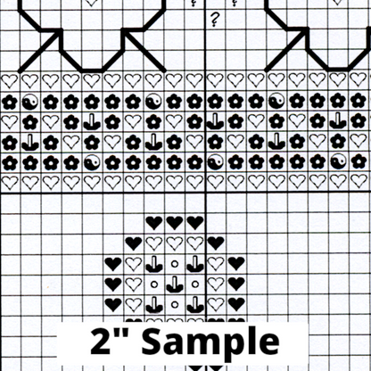 Part of the printed cross stitch chart, showing 2” section of the gridded pattern, with black/white symbols for each stitch.