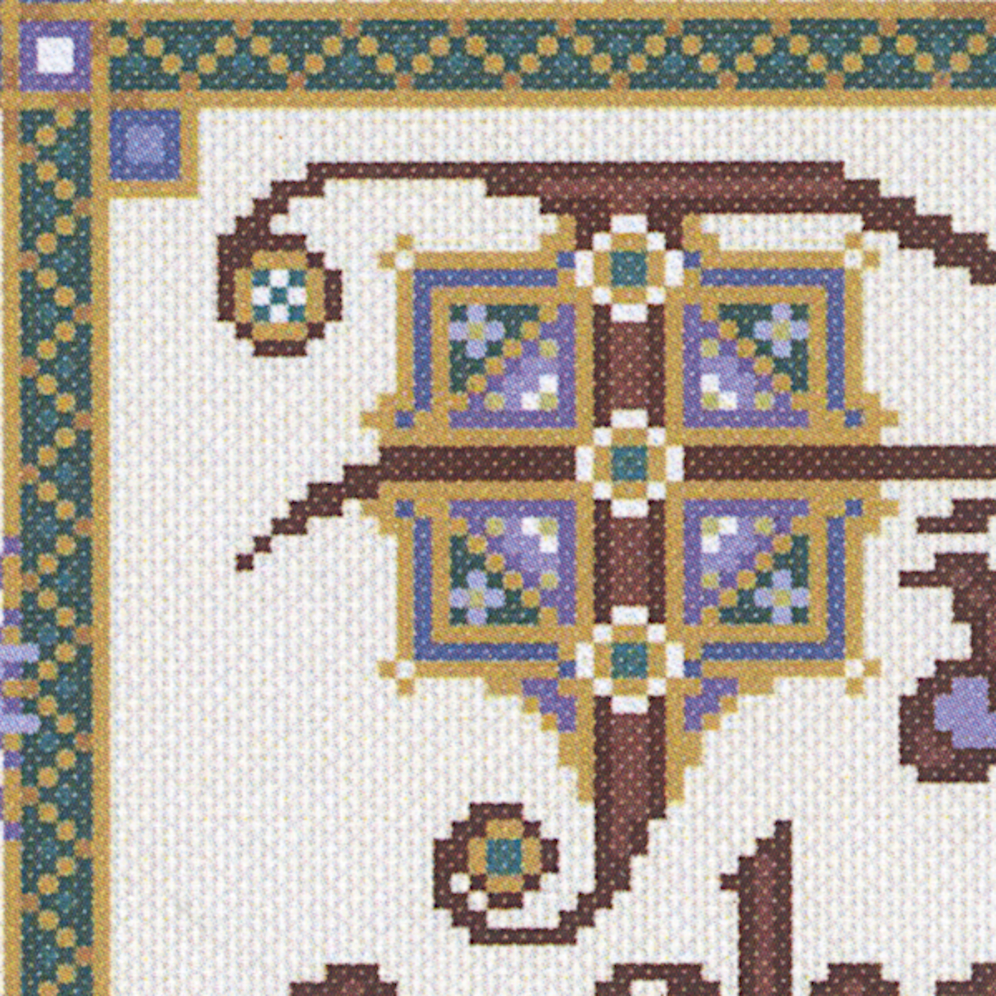 Close-up of the Fáilte a Chairde cross stitch design, highlighting the illuminated Celtic-style letter 'F' in jewel tones.