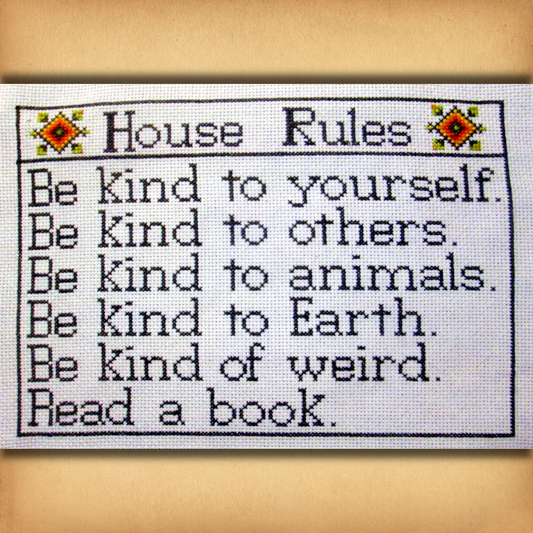 House Rules cross stitch design listing reminders to be kind, embrace weirdness, and read books, within a simple border.