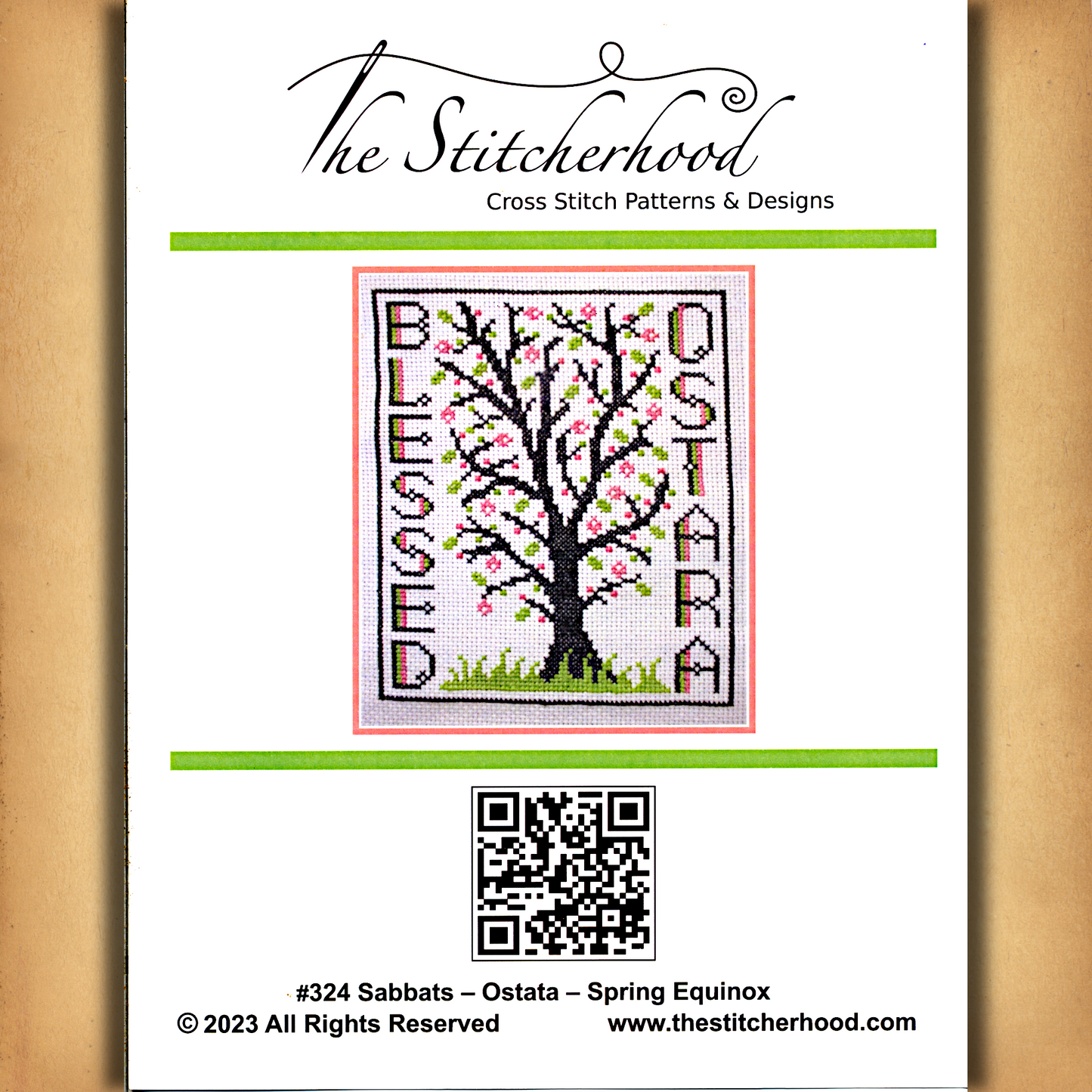 Cover of the printed Blessed Ostara cross stitch pattern, displaying a color picture of the completed spring-themed design.
