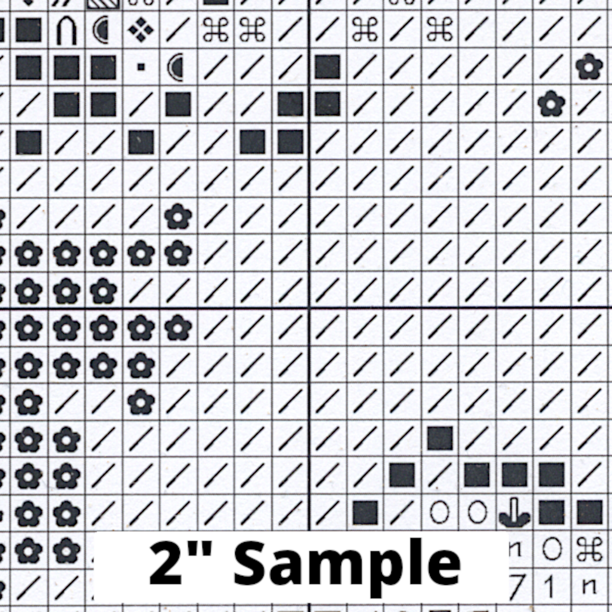 Part of the printed cross stitch chart, showing 2” section of the gridded pattern, with black/white symbols for each stitch.
