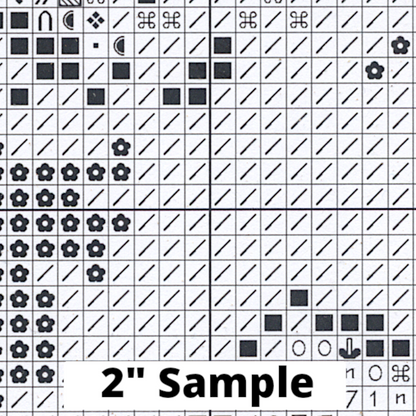 Part of the printed cross stitch chart, showing 2” section of the gridded pattern, with black/white symbols for each stitch.